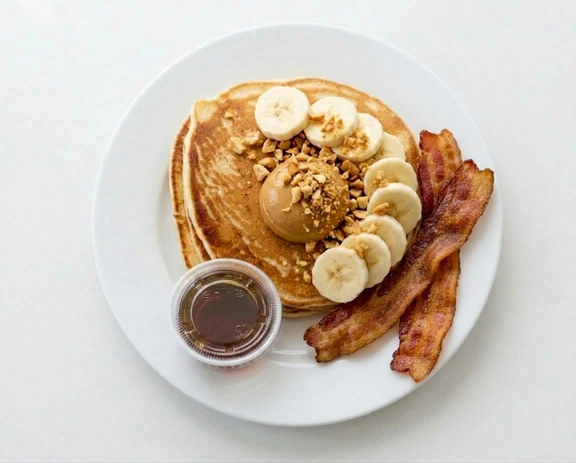 Elevate your morning breakfast with our chef-crafted Artisanal Clean-Fuel PB Banana Hotcakes.